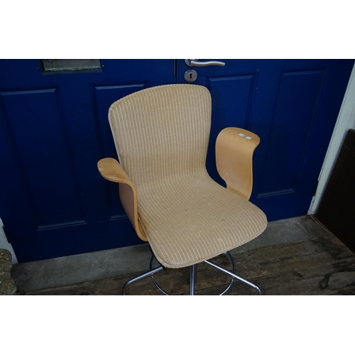 509 - A Lloyd Loom Swivel Base Steamed Plywood armed Office Chair resting on Five Legs & Castors. Silver P... 