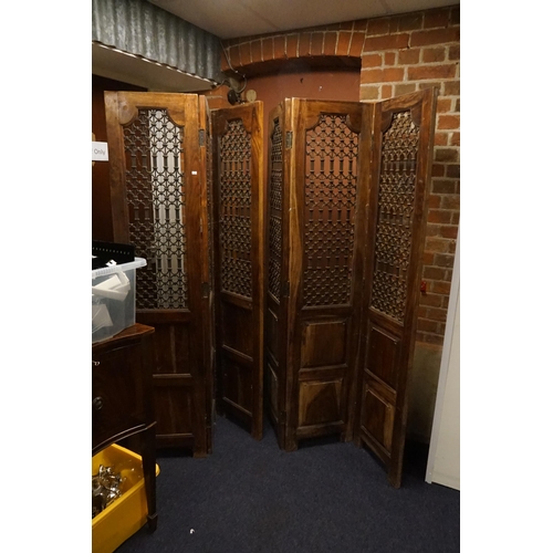 518 - A Pair of Moroccan Three Folding Hardwood & Wrought Iron Screens with panelled bases. Measuring: 185... 