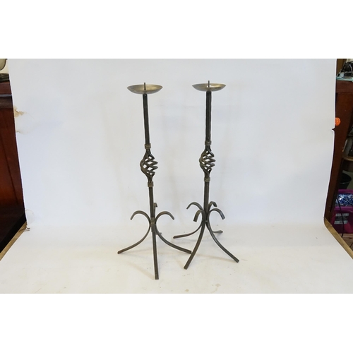 596 - A Pair of Iron Twist & Swept out Candlestick Holders. Measuring: 59cms high.