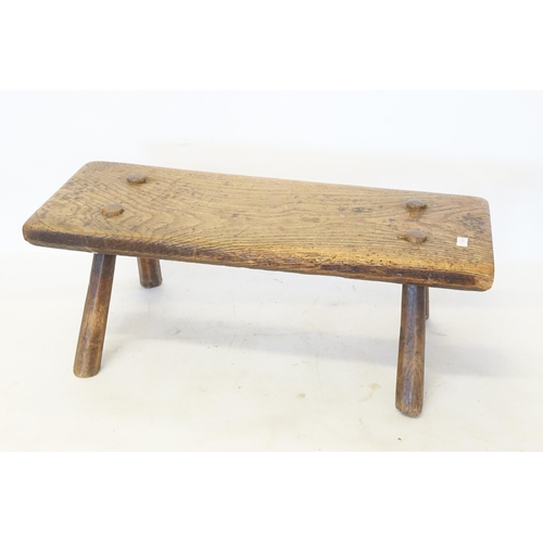 533 - An Antique Elm Milking Stool with Pegged Legs.