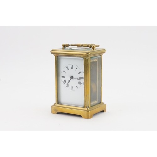 274 - A French Brass Cased Carriage Clock with visible escapement, Enamel Dial & Key.