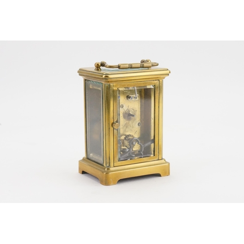 274 - A French Brass Cased Carriage Clock with visible escapement, Enamel Dial & Key.