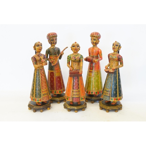 391 - A Set of Four Indian Painted Wood & Coloured Musical Precession Figurines. Measuring: 30cms high.