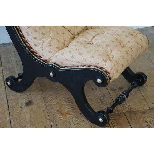 531 - A Victorian Brass mounted & Beaded ebonised low down Nursing Chair with button back upholstered in C... 