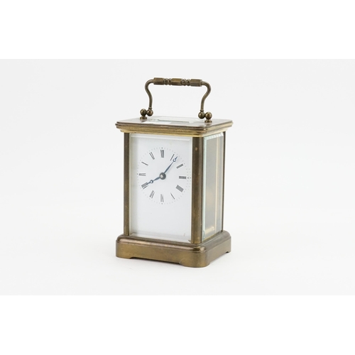 273 - A Brass Cased Four Plate Carriage Clock with Oscillating movement, Swing Handle & Key. Measuring: 13... 