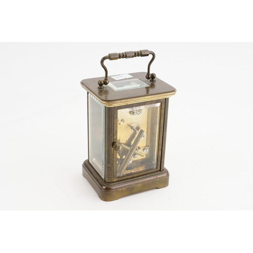 273 - A Brass Cased Four Plate Carriage Clock with Oscillating movement, Swing Handle & Key. Measuring: 13... 