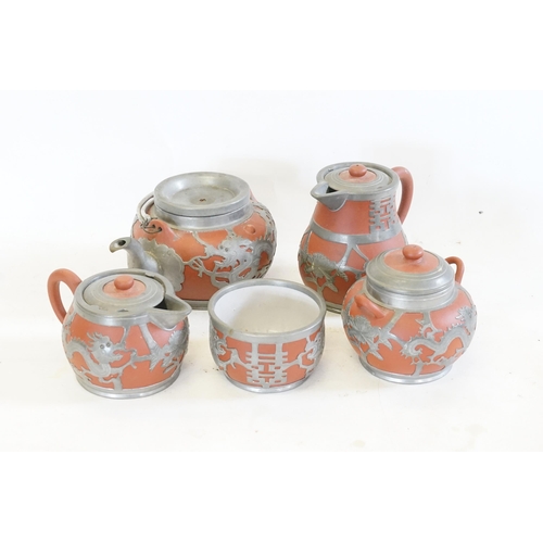 319 - A Five Piece Early 20th Century Chinese Hor Chung Pewter Mounted Yixing Clay Tea Set. The teas set i... 