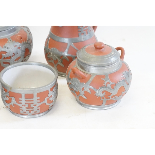 319 - A Five Piece Early 20th Century Chinese Hor Chung Pewter Mounted Yixing Clay Tea Set. The teas set i... 