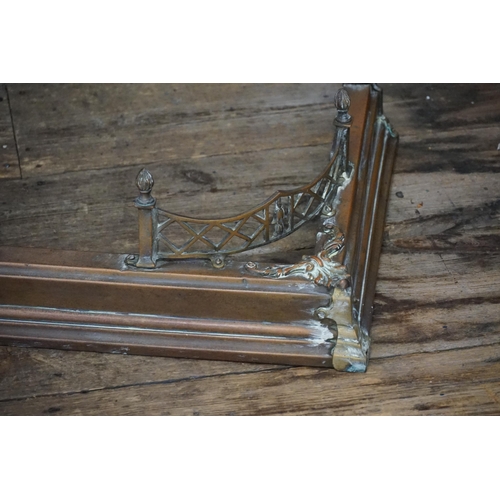 600 - A Late 19th Century Brass Fire surround with Vase & Peirce decoration. Measuring: 106cms (Inner) x 3... 