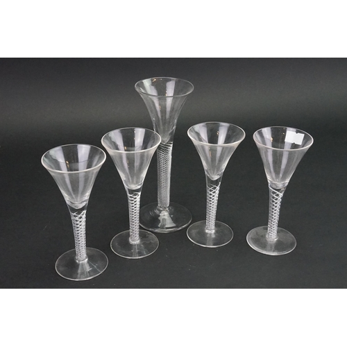 724 - An Antique Air Twist Trumpet Shaped Wine Glass on a raised base & Four modern Wine Glasses.