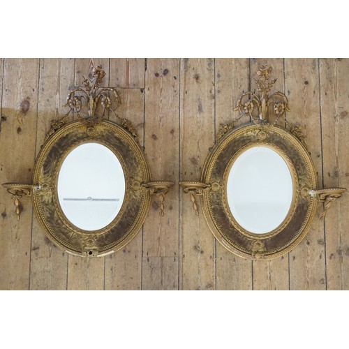 561 - A Pair of Gesso Girandole Mirrors in an Adams & Floral Festooned Frames with Side Vase Supports & Ov... 