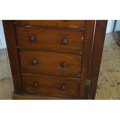 482 - A Victorian Walnut Wellington Chest with Locking Pilaster with a bank of seven Graduated drawers. Me... 