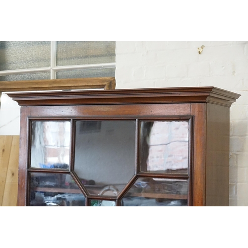 485 - A Chippendale design Astragal Glazed Display Cabinet with fitted shelves & resting on Bracket Feet. ... 