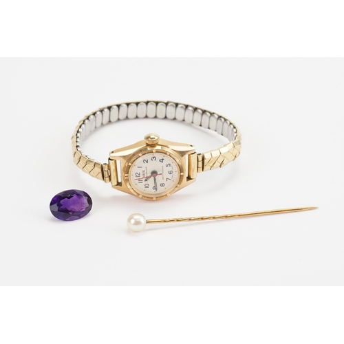 187 - An Amethyst Gem Stone along with a Pearl Stick pin and a Gold coloured Oris watch.