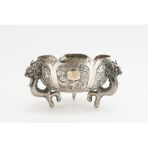 14 - A Chinese Export Silver Dragon bowl, circa 1900s, decorated with dragons and scenes. Seal mark to ba... 