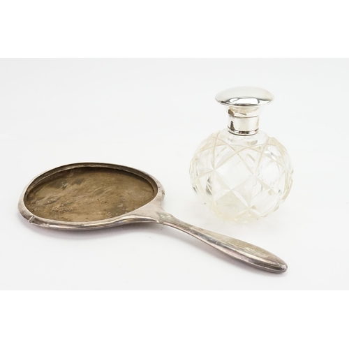 17 - A Silver topped bottle along with a Silver mirror handle, no glass.