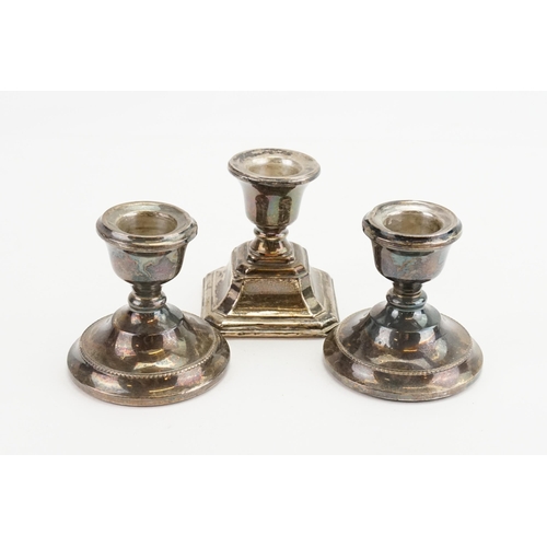 22 - Three Silver Candlestick holders.