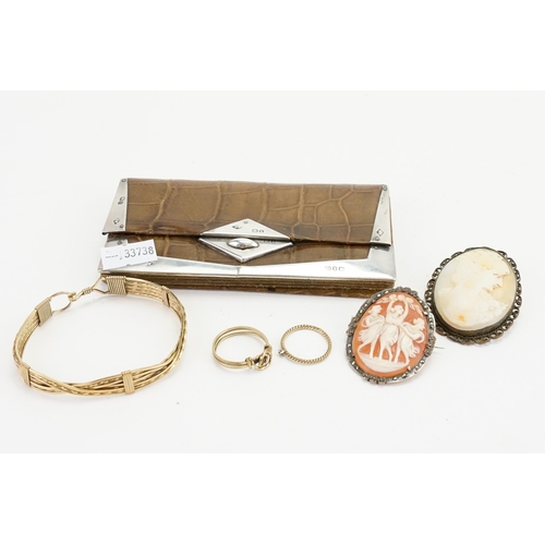 185 - A Silver mounted Coin purse along with two cameo brooches, a bangle and a Ring.