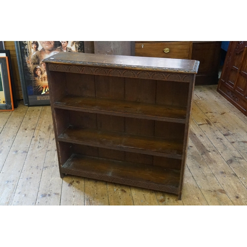 490 - A Victorian Carved Oak Open Fronted Bookcase with fitted shelves. Measuring: 94cms across x 91cms hi... 