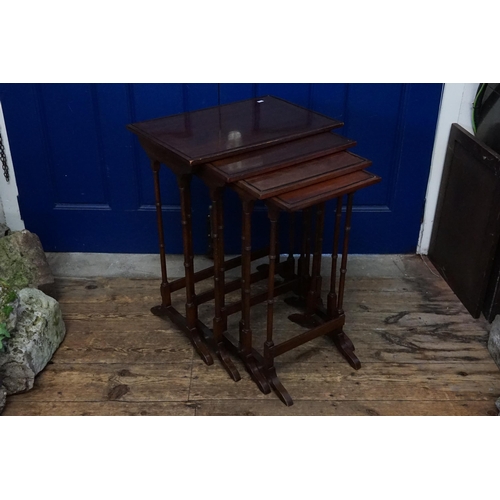 493 - A Victorian Mahogany Set of Four Graduated Tables resting on Spindle Legs. Measuring: 56cms x 38cms ... 