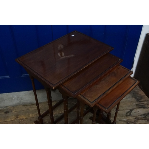 493 - A Victorian Mahogany Set of Four Graduated Tables resting on Spindle Legs. Measuring: 56cms x 38cms ... 