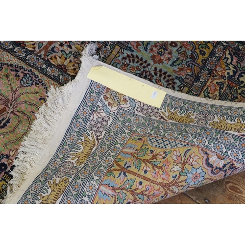 570 - A Cashmere Silk Rug designed with Ten Floral decorated Cartouches & a Tiger Quadruple Border. Measur... 