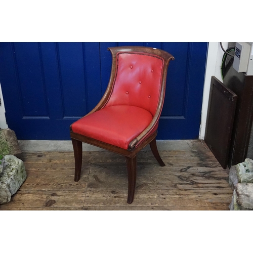 494 - A Regency design Scroll Back Carved Edged Desk Chair resting on Sabre Legs & upholstered in Red.