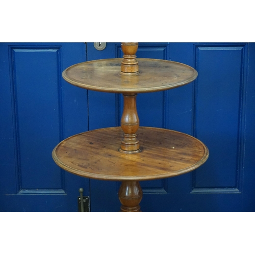 496 - A Victorian Mahogany Three Tiered Dumb Waiter resting on a Tripod Base. Measuring: 123cms high.