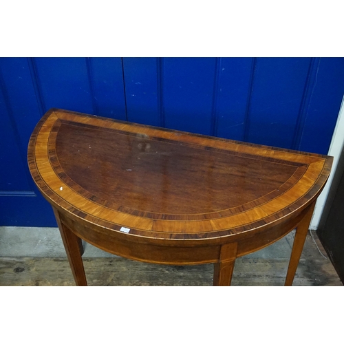 498 - A Regency design Chestnut & Laburnum Fold-Over Top Card Table resting on square tapering spade feet.... 