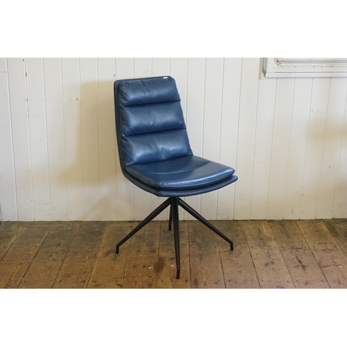 500 - A Set of Six Modern Over Stuffed Swivel Dark Blue Dining Chairs resting on a 1950s design Legs.