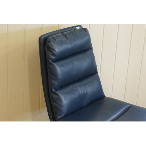 500 - A Set of Six Modern Over Stuffed Swivel Dark Blue Dining Chairs resting on a 1950s design Legs.