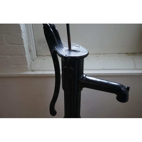 586 - A Large Pump Action Cast Iron Water Pump in Black. Measuring: 138cms high.