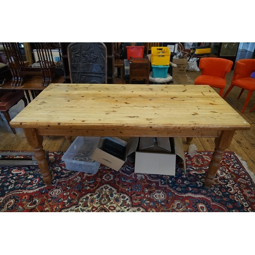 469 - A Victorian design Scrubbed Top Pine Table resting on turned legs. Measuring: 180cms long x 90cms ac... 