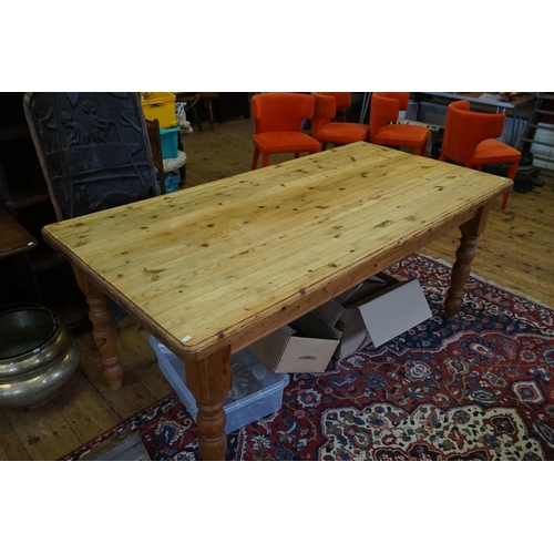 469 - A Victorian design Scrubbed Top Pine Table resting on turned legs. Measuring: 180cms long x 90cms ac... 