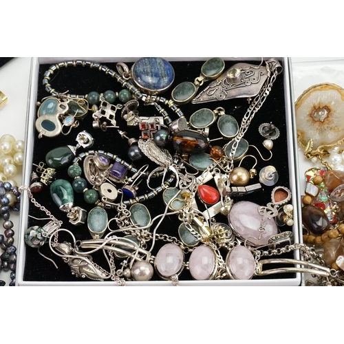 194 - A collection of costume jewellery to include silver costume, necklaces, pearls, onyx set, two wrist ... 