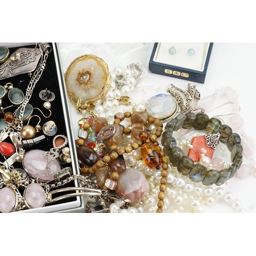 194 - A collection of costume jewellery to include silver costume, necklaces, pearls, onyx set, two wrist ... 