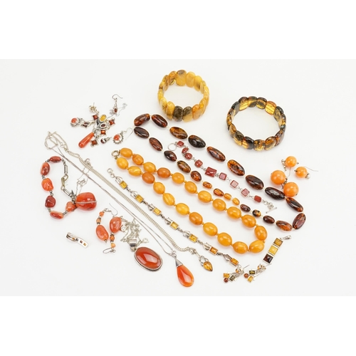 195 - A collection of amber coloured jewellery to include bracelets, necklaces, beads, earrings, etc.