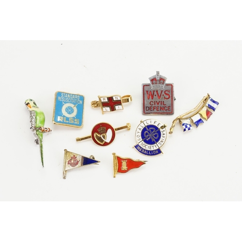 197 - A collection of various enamelled badges, including saving society, RNLI, 9ct gold flag brooch (4.7g... 