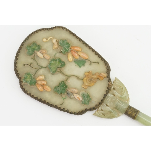 308 - An Antique Chinese jade mirror decorated with rats in a fruit tree & metal mounted.