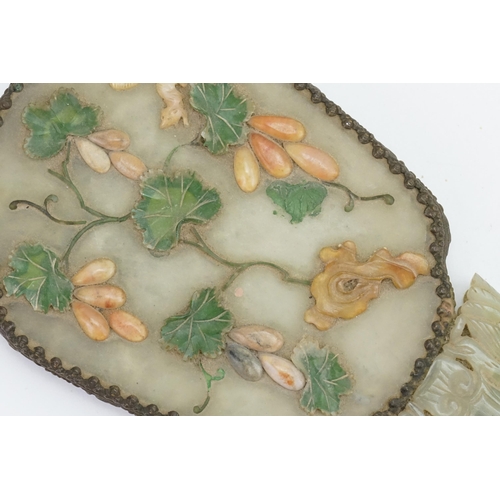 308 - An Antique Chinese jade mirror decorated with rats in a fruit tree & metal mounted.