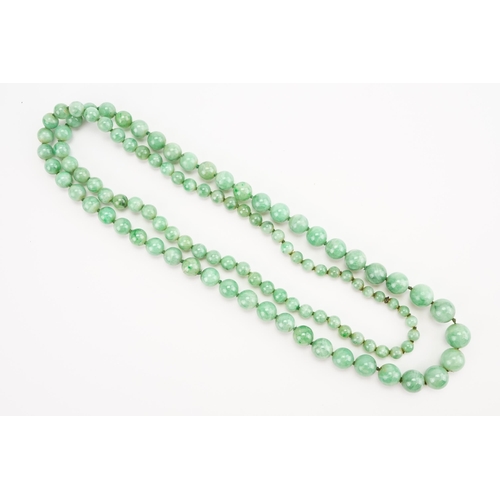 168 - A string of Graduated Jade bead necklace. Weight 59.1g. Length 74cm approx.