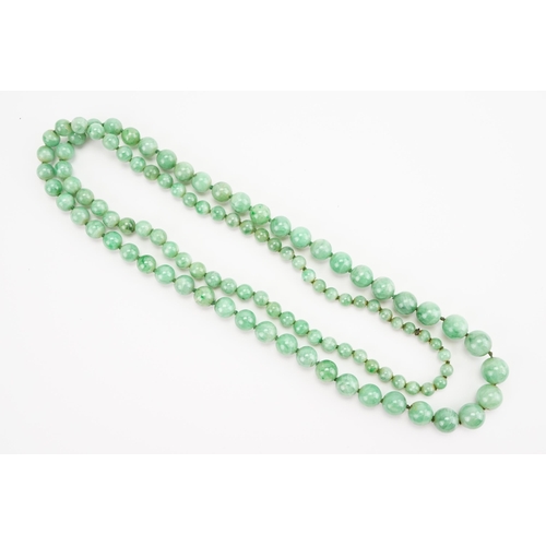 168 - A string of Graduated Jade bead necklace. Weight 59.1g. Length 74cm approx.