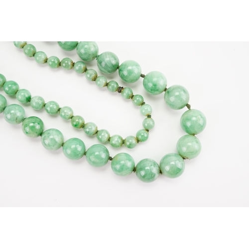 168 - A string of Graduated Jade bead necklace. Weight 59.1g. Length 74cm approx.