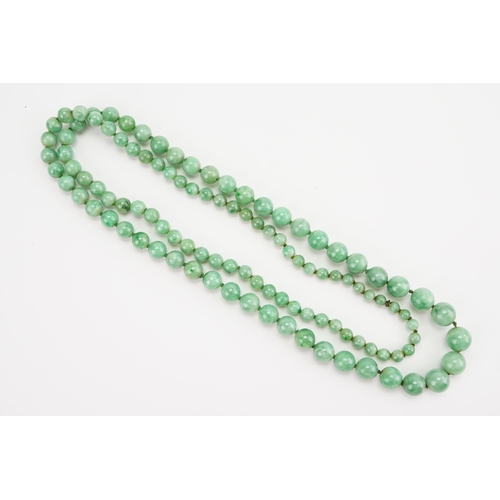 168 - A string of Graduated Jade bead necklace. Weight 59.1g. Length 74cm approx.