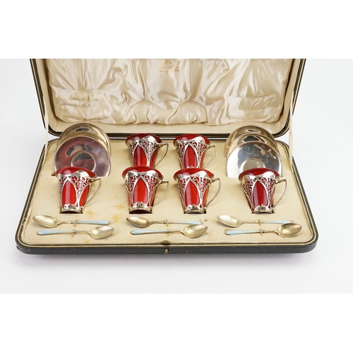 61 - A Cased set of Art Nouveau Six Silver mounted Royal Doulton flambe coffee cups and saucers, dated 19... 