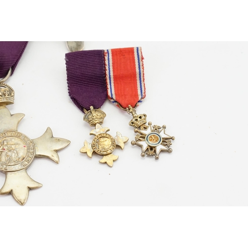 615 - A silver order of the British Empire medal, along with a miniature order of ST. OLAF Norway enamelle... 