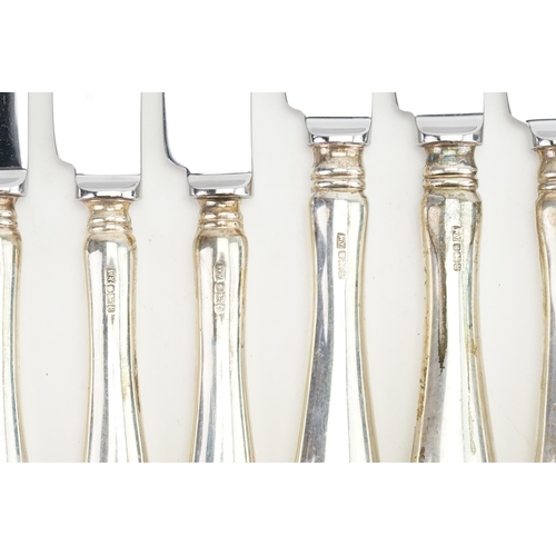 83 - A Set of 12 Silver handled Stainless Steel Knives.