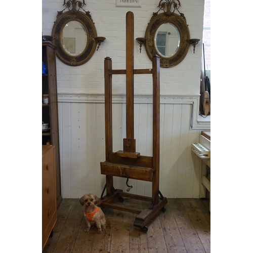 553 - A Large Late 19th Century Chestnut Easel with winding mechanism, Block rest & Thumb Piece. Measuring... 