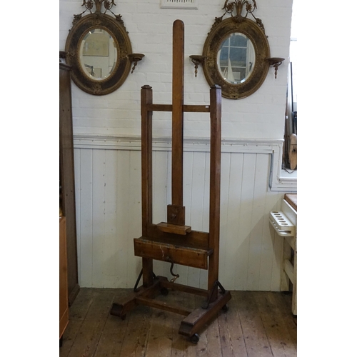 553 - A Large Late 19th Century Chestnut Easel with winding mechanism, Block rest & Thumb Piece. Measuring... 