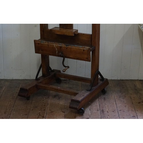 553 - A Large Late 19th Century Chestnut Easel with winding mechanism, Block rest & Thumb Piece. Measuring... 